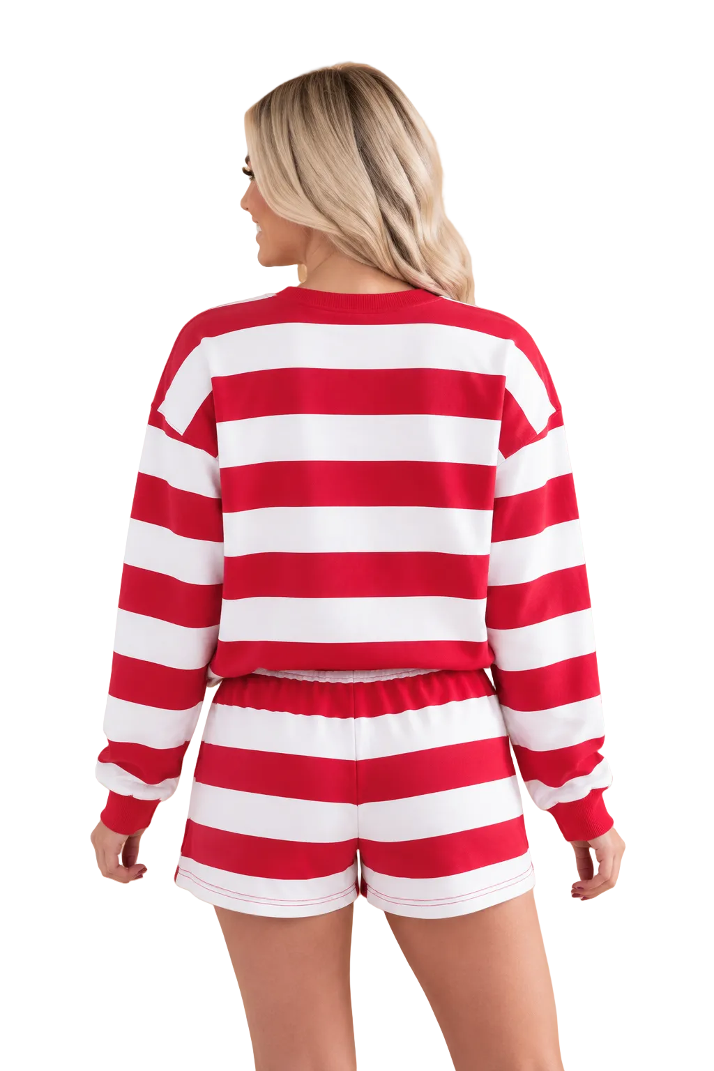 A woman shown from the back wearing a red and white striped long-sleeve crop top and matching striped shorts against a solid tan studio background.