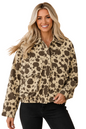 A woman modeling a beige and brown spotted animal print jacket against a solid peach background.