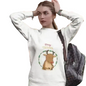 Person wearing a white hoodie with a reindeer design and 'Merry Christmas' text.