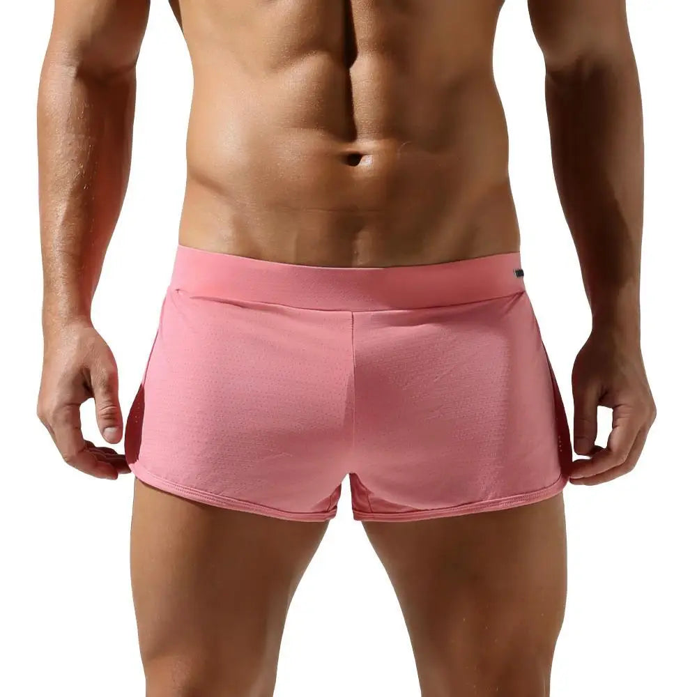 Person wearing pink shorts on a white background
