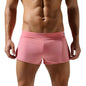 Person wearing pink shorts on a white background