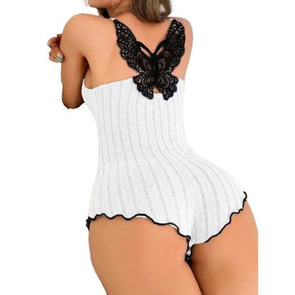 White ribbed romper with black lace details on a neutral background