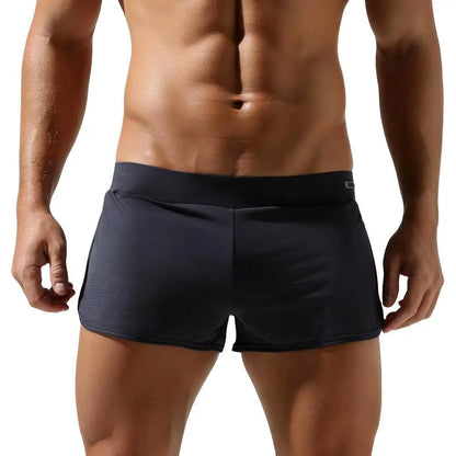 Man wearing black athletic shorts on a white background