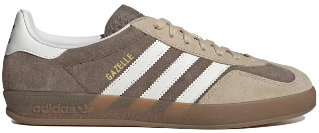 A side profile view of an Adidas Gazelle sneaker in brown suede and beige canvas, featuring white three-stripes, gold 'GAZELLE' text, and a translucent brown gum sole.