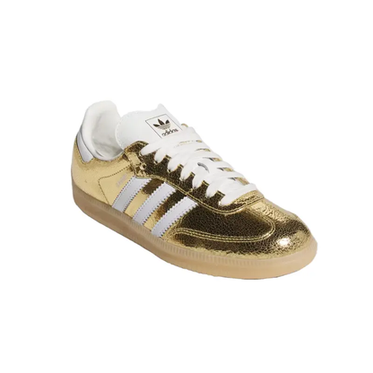 Gold Adidas sneaker with white stripes on a white background