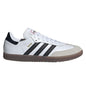 A white Adidas Samba sneaker with black three-stripes, a black heel tab, gold 'SAMBA' text, and a brown gum sole, shown in a side profile on a white background.