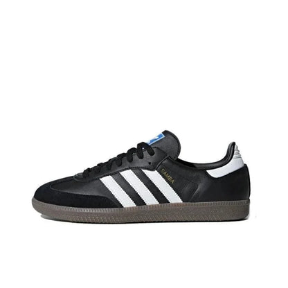 Black Adidas sneaker with white stripes on a white background