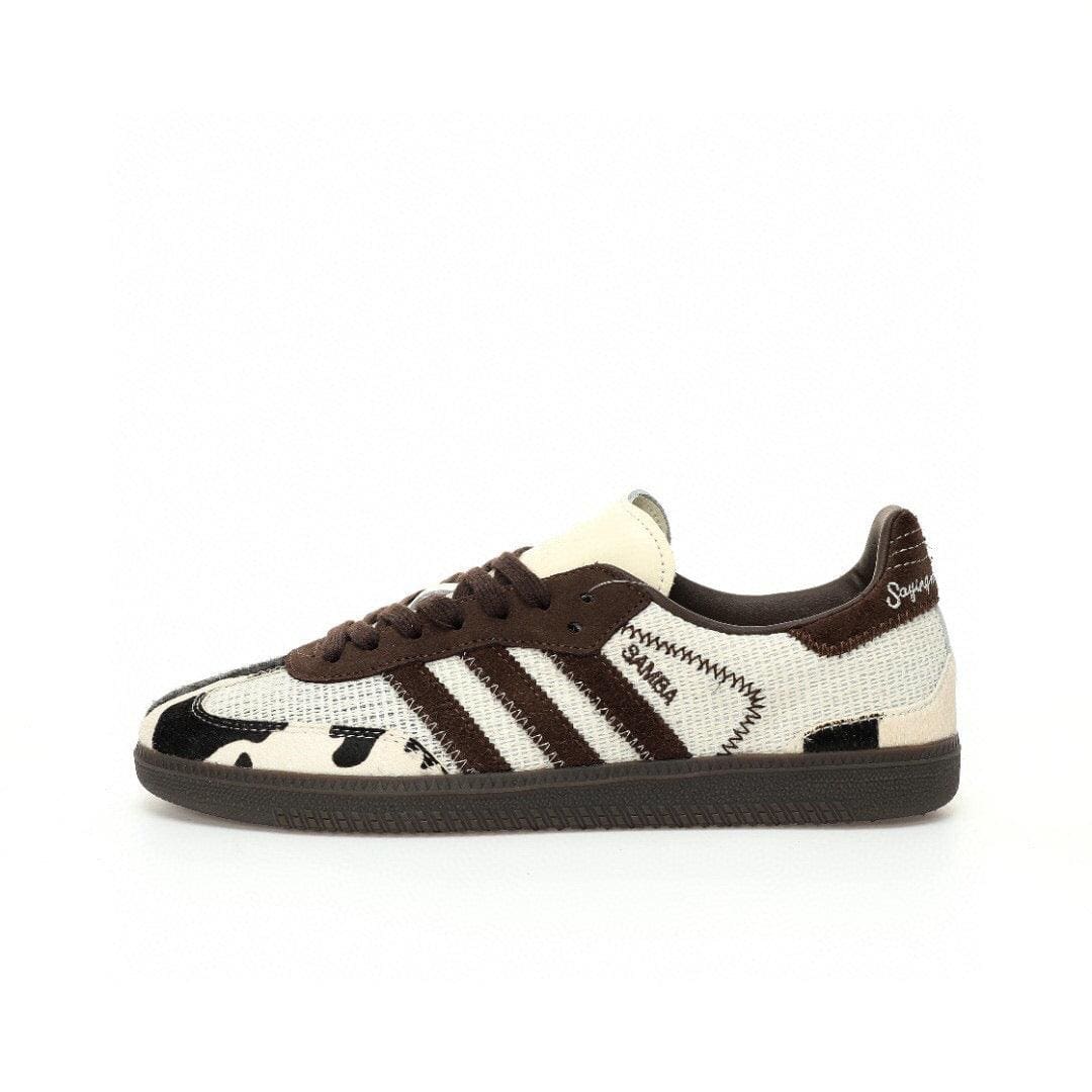 Brown and white sneaker with Adidas logo on a white background