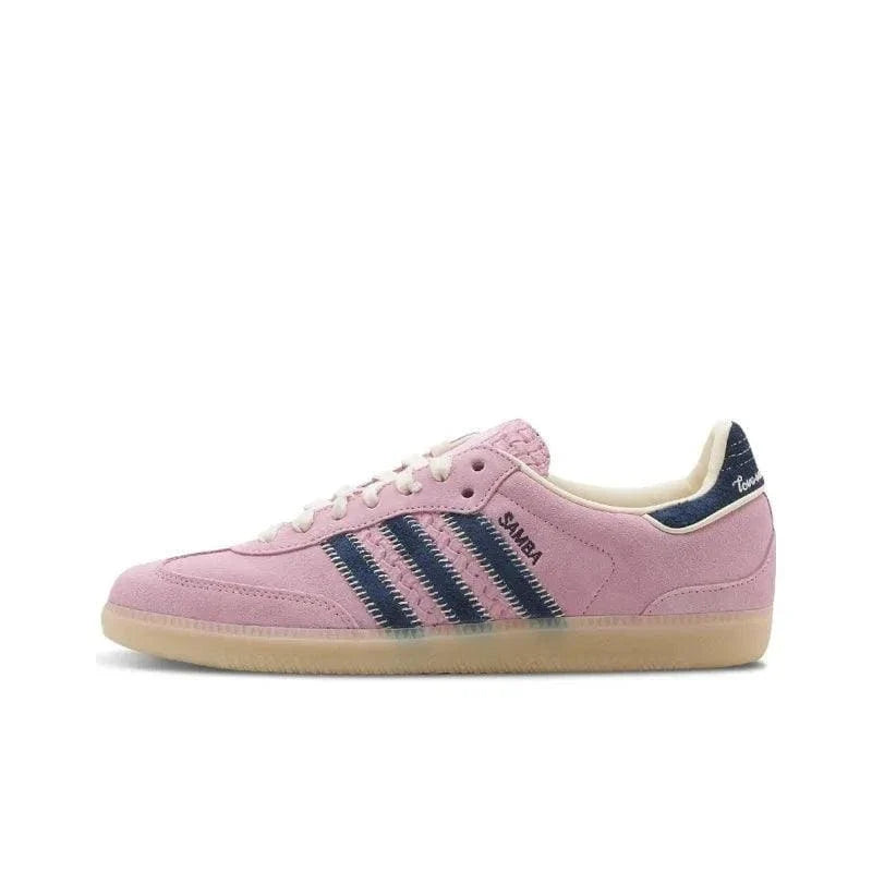 Pink sneaker with navy stripes on a white background