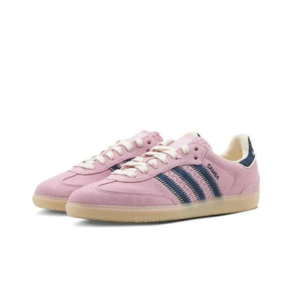 Pink sneakers with blue stripes on a white background