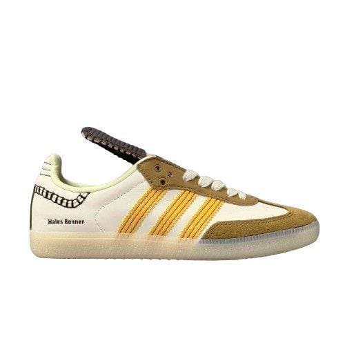 Sneaker with yellow and brown design on a white background