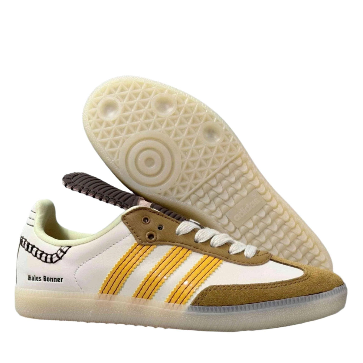 Sneaker with yellow stripes on a white background