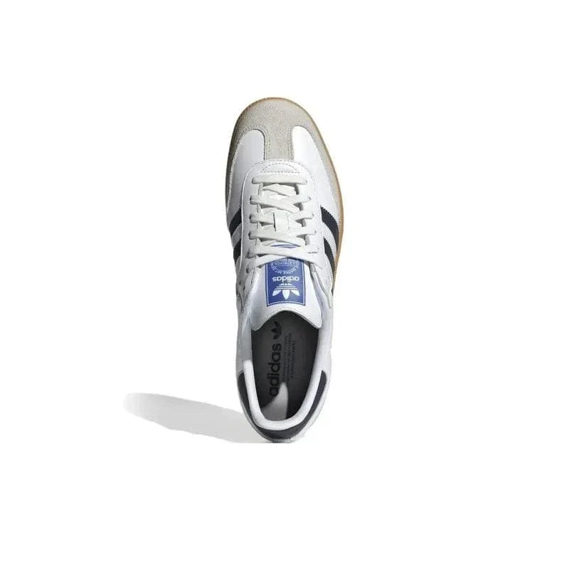 White Adidas sneaker with blue logo on a white background