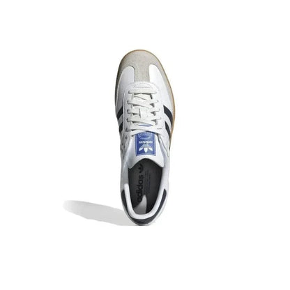 White Adidas sneaker with blue logo on a white background
