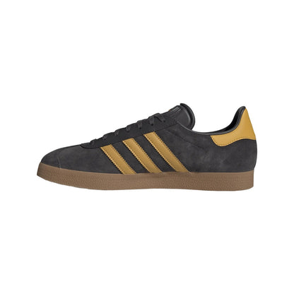 Black and yellow Adidas sneaker on a white background