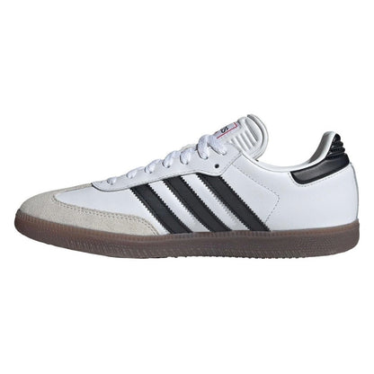 White sneaker with black stripes on a white background
