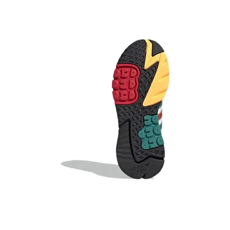Colorful sole of a shoe with red, yellow, and green accents on a white background
