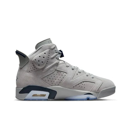Gray sneaker with blue accents on a white background