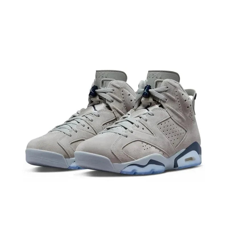 Pair of light gray high-top sneakers on a white background