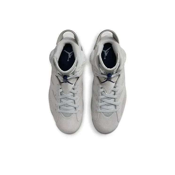 Pair of white high-top sneakers with blue accents on a white background