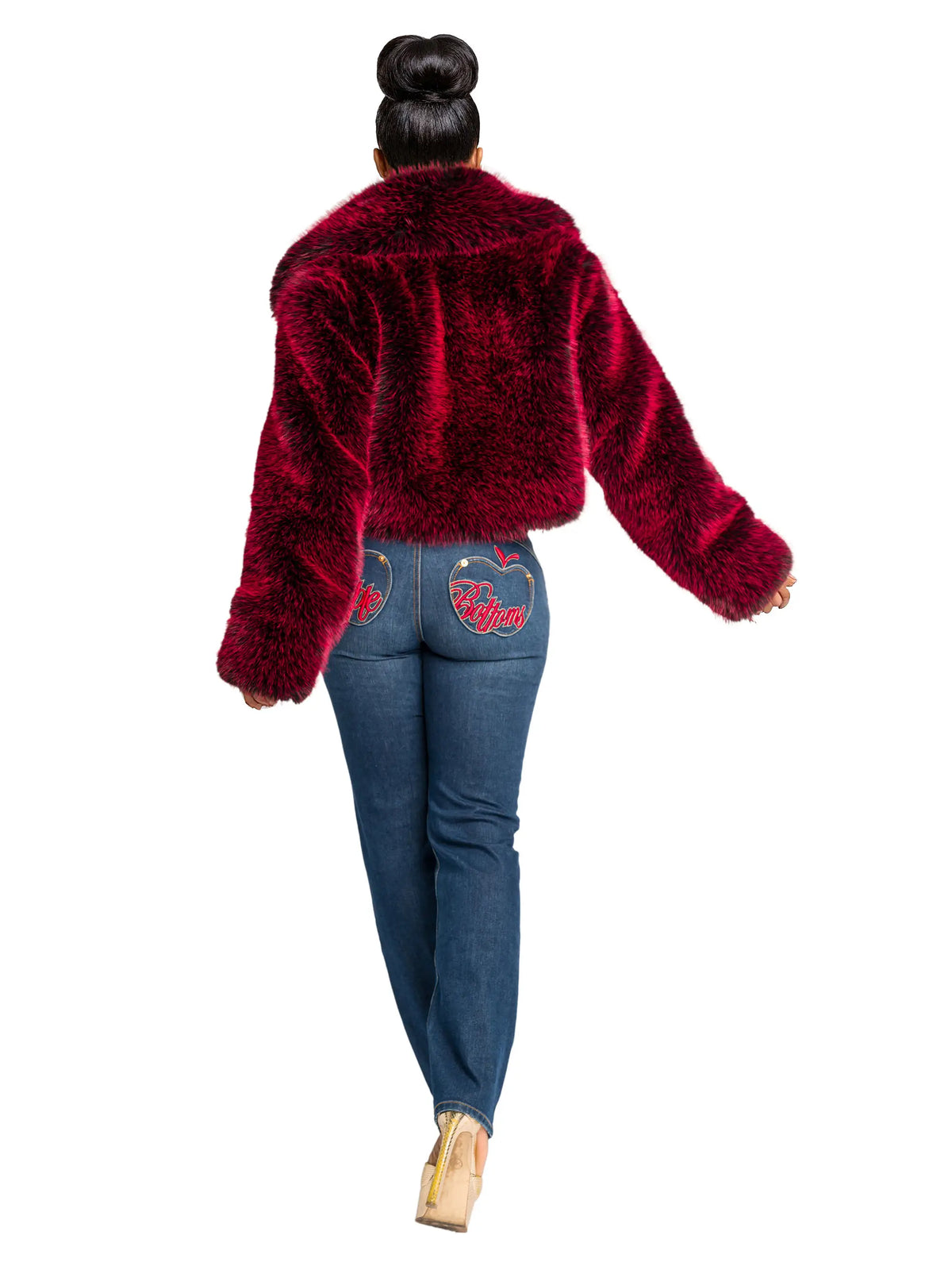 Person wearing a red fluffy jacket and blue jeans on a white background