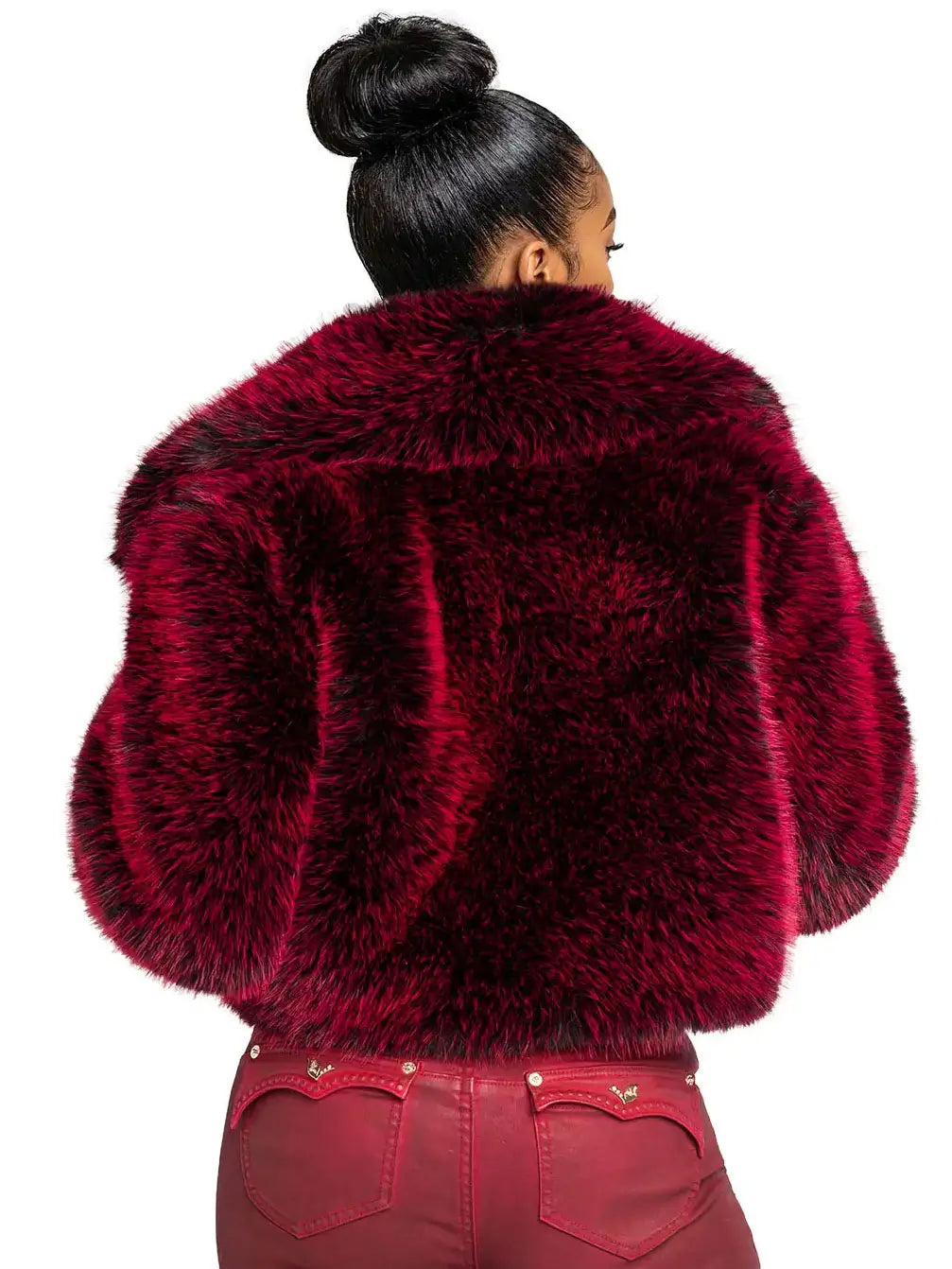 Person wearing a red fluffy jacket on a white background