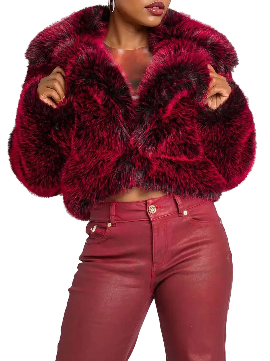 Red fur jacket worn by a person on a white background