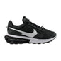 A Nike sneaker in black and white, featuring a black upper with a white Swoosh logo, a thick white midsole, and a black sole with a visible air cushion unit.