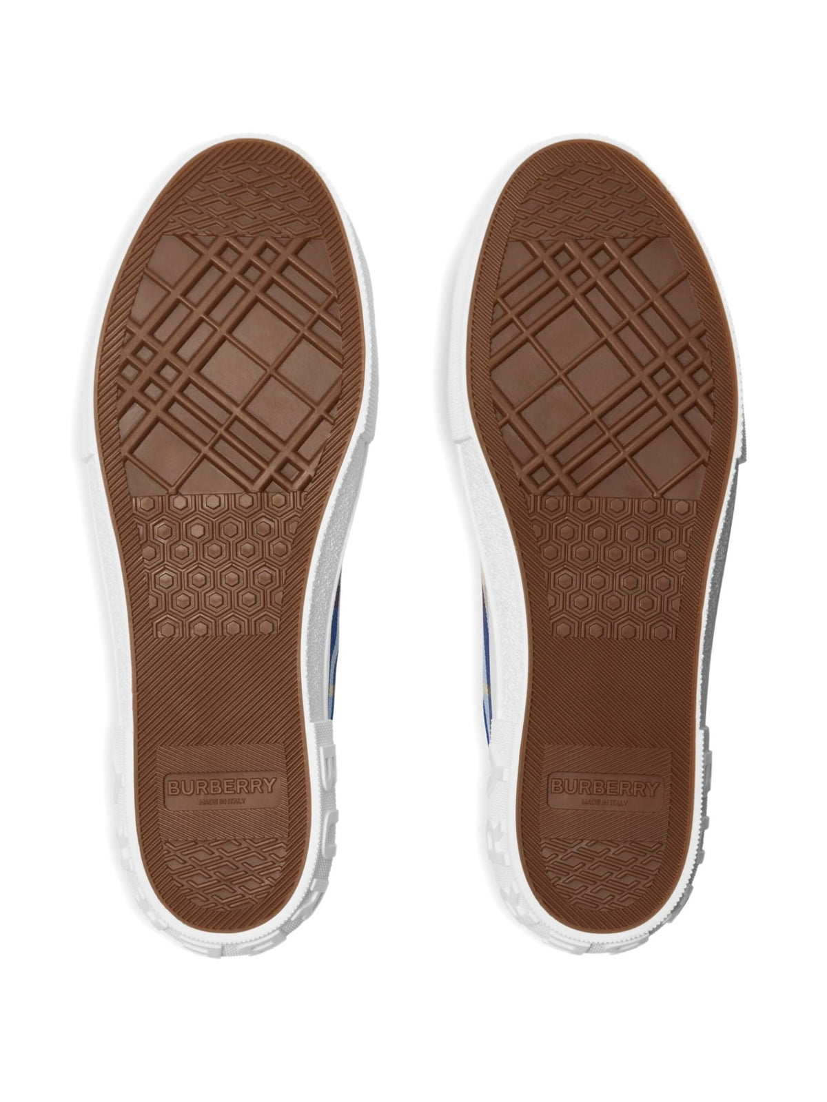 Brown sole of a shoe with a visible brand logo on a white background