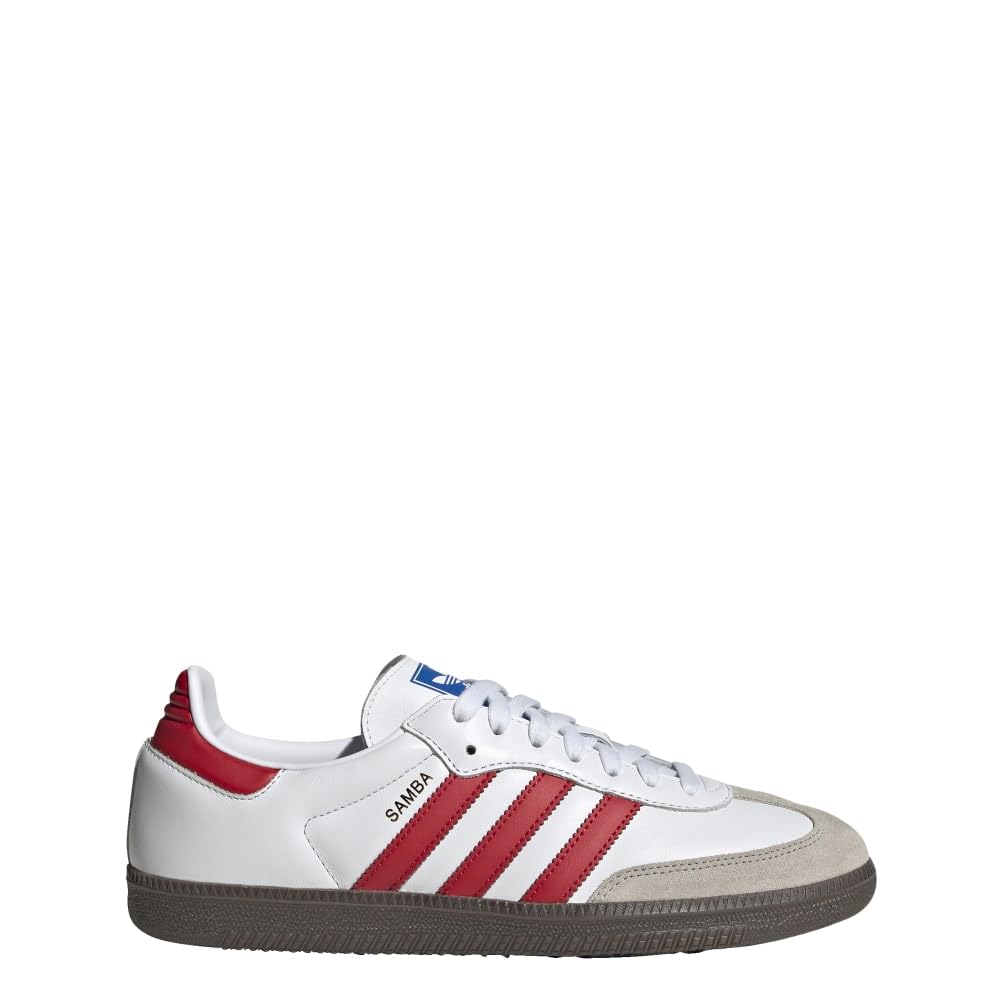 A white Adidas Samba sneaker with red three-stripes, a red heel tab, a beige suede toe cap, and a dark brown gum sole, shown from the side on a white background.