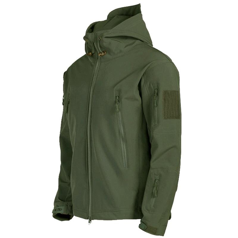 An olive green hooded tactical jacket with multiple zippered pockets and a hook-and-loop patch panel on the upper sleeve, shown against a plain white background.