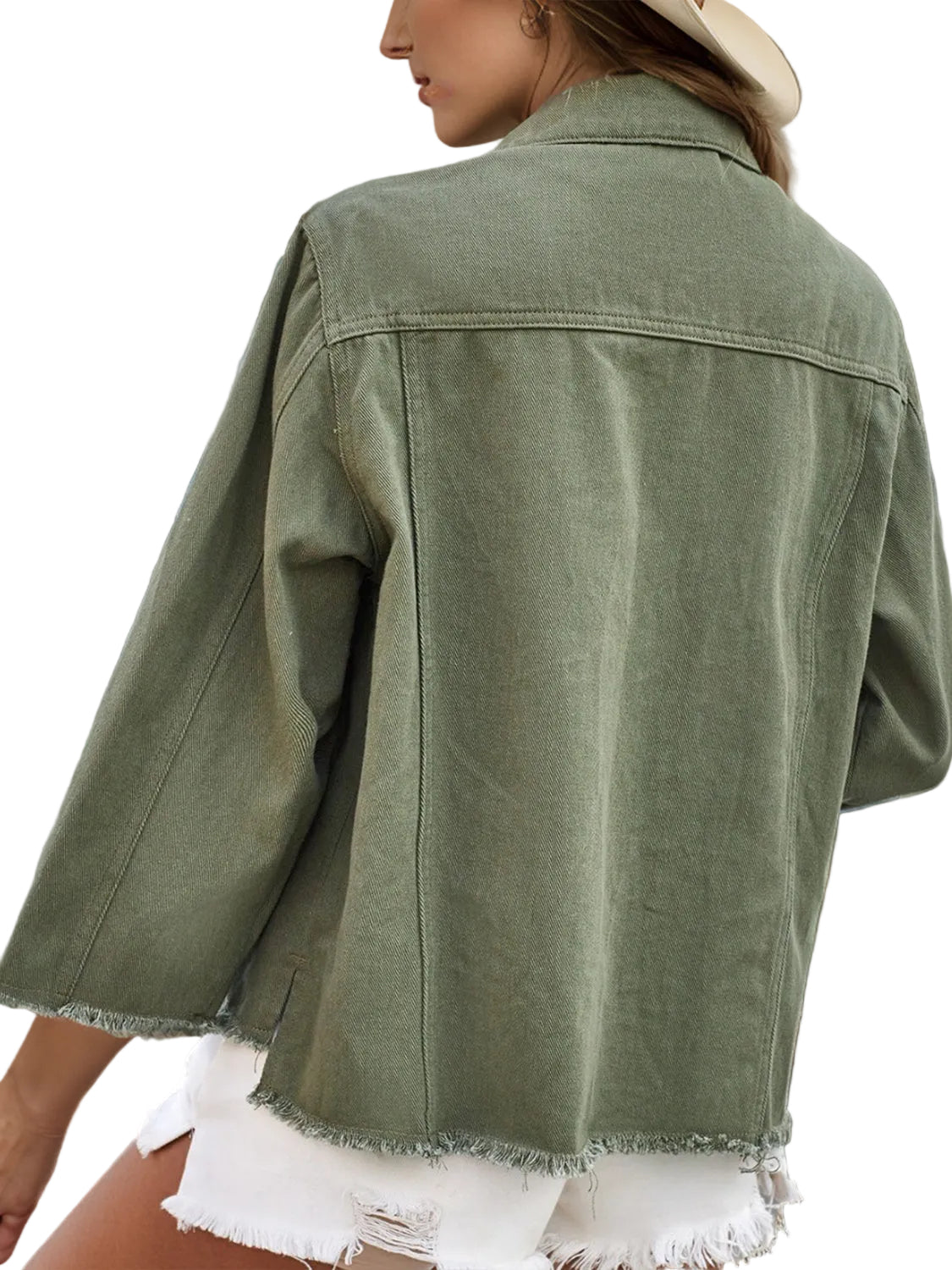 Person wearing a green denim jacket with a horse painting in the background