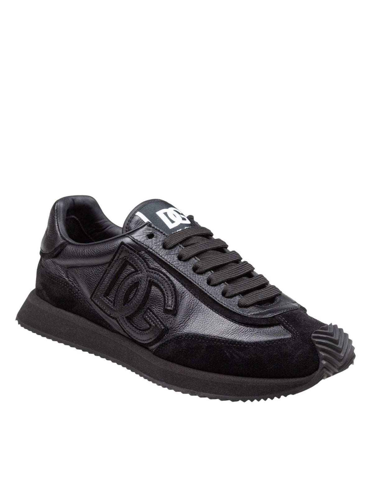 Black sneaker with brand logo on a white background