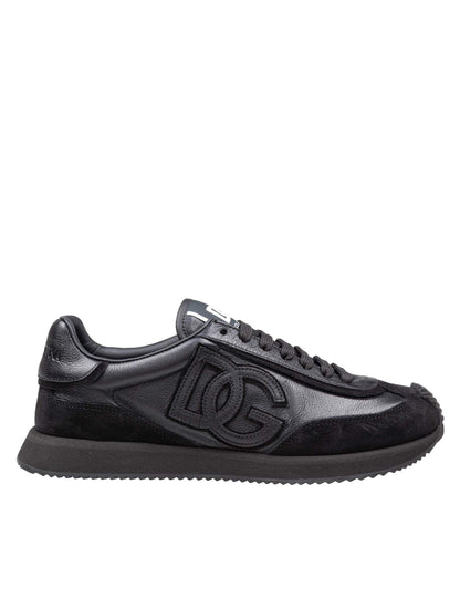 Black sneaker with a brand logo on a white background