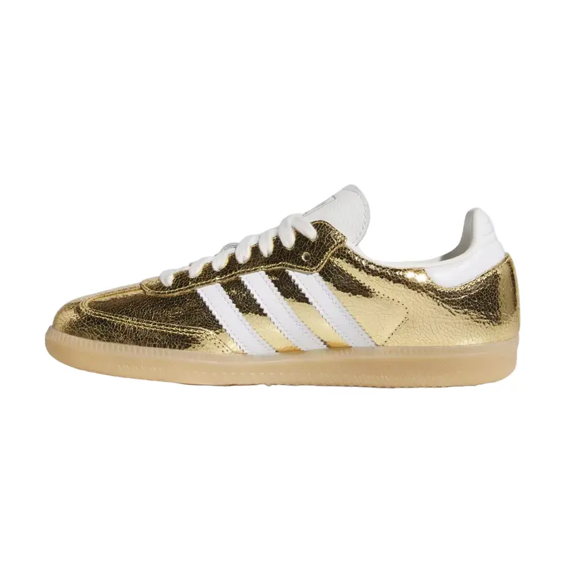 Gold Adidas sneaker with white stripes on a white background