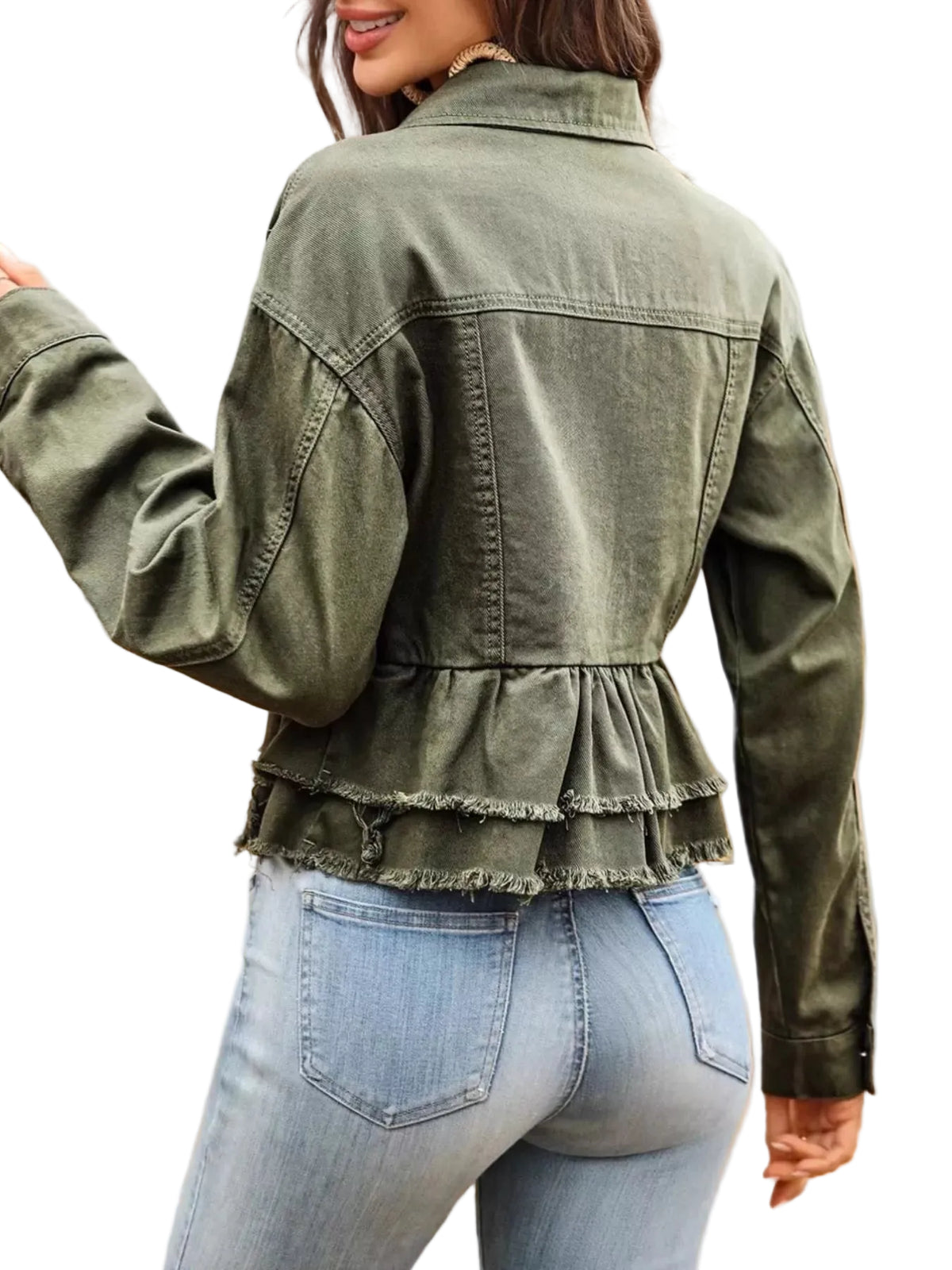 Person wearing a green denim jacket with ruffled details and light blue jeans.