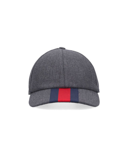 Gray baseball cap with a red and blue stripe on a white background
