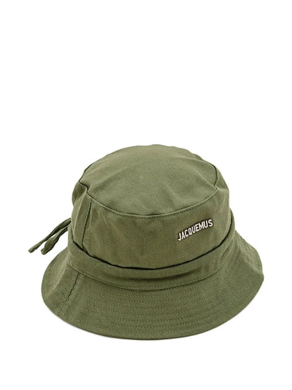 Green bucket hat with 'Jacquemus' branding on a white background