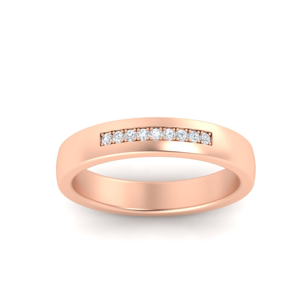 Rose gold ring with small diamonds on a white background