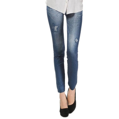 Blue distressed jeans worn by a person on a white background