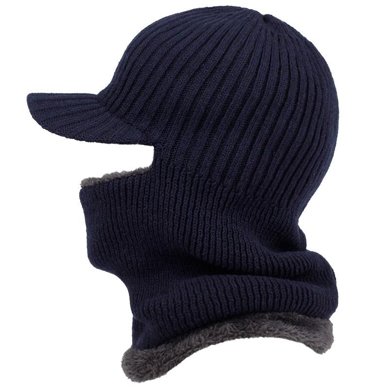 Navy blue knitted balaclava with gray trim on a white background