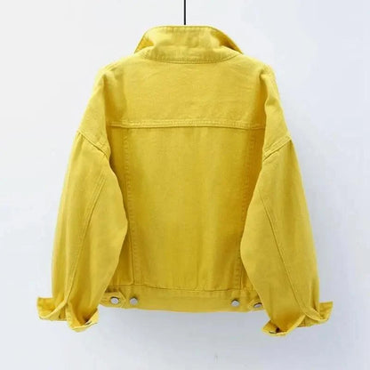 A bright yellow denim jacket shown from the back, hanging against a plain white background.