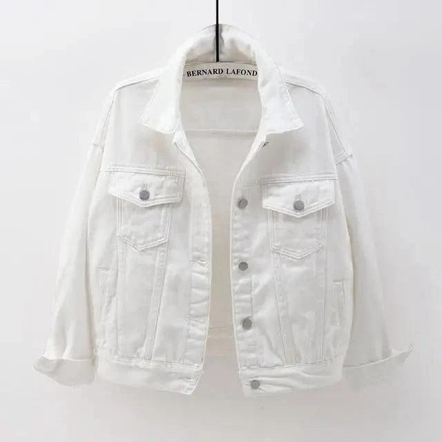A white denim jacket with a pointed collar, button front, and two chest flap pockets, hanging against a plain light background. The neck label reads BERNARD LAFOND.