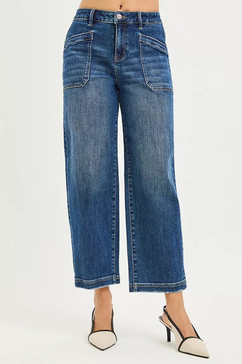 Blue jeans worn by a person on a white background