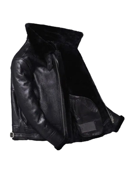 Black leather jacket with fur lining on a gray background