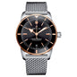 A Breitling Super Marine chronometer watch with a black dial, black bezel, silver-toned steel mesh bracelet, and a rose gold-tone bezel and indices, shown on a plain white background.