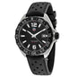 Black TAG Heuer watch with a black strap on a white background