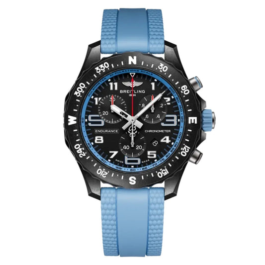 A Breitling chronometer watch with a black case, black dial, blue bezel, and a textured light blue silicone strap, shown against a plain white background.