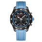 A Breitling chronometer watch with a black case, black dial, blue bezel, and a textured light blue silicone strap, shown against a plain white background.